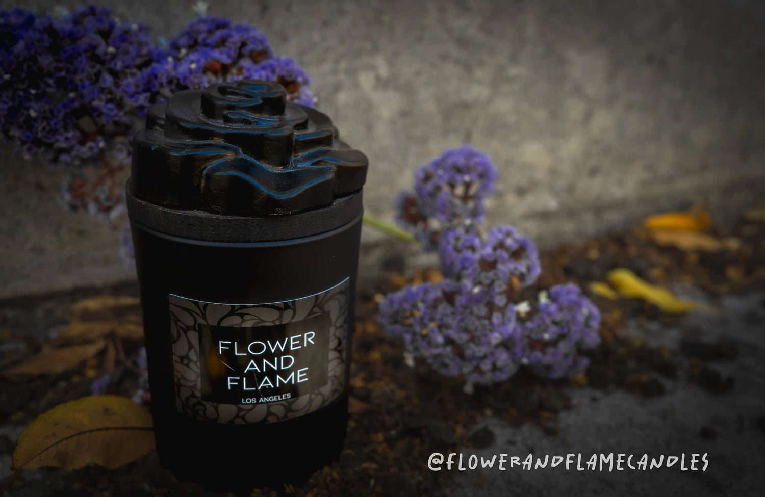 Flower and Flame Candle with purple flowers 